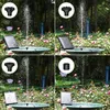 A collage of four images showing a solar-powered fountain in a bird bath, with different nozzle attachments creating various water spray patterns. The background is a garden setting with roses and trees. Produktbild-Vorschau