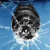 A safety hammer is shown breaking through a cracked glass surface. Náhled obrázku produktu