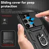 A hand is holding a black phone case with a sliding camera cover and a ring holder. The image highlights the features of the phone case. Produktbild-Vorschau
