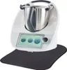 A kitchen appliance with a touchscreen display and a stainless steel bowl, placed on a dark mat. Produktbild-Vorschau
