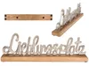 Three views of a decorative wooden base with a silver-colored script word art. Produktbild-Vorschau