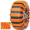 A close-up of a car tire fitted with orange snow chains, with a small inset showing a magnified view of the chain's texture. Náhled obrázku produktu