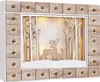 A wooden advent calendar with 24 drawers, featuring a winter scene with deer and trees illuminated by warm white LED lights. Anteprima dell’immagine prodotto