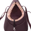 A close-up view of the opening of a brown pet carrier bag with a tan, fuzzy lining. Produktbild-Vorschau