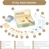 A toy cash register set with various accessories laid out on a white background, with numbered labels pointing to different components. Produktbild-Vorschau