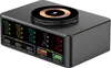 A black multi-port charging hub with a wireless charging pad on top, displayed on a white background. The front of the hub features multiple digital displays showing power output information for various ports. Produktbild-Vorschau