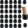 A collection of black chair leg protectors. Produktbild-Vorschau