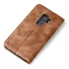 A brown leather flip case for a smartphone is shown from a diagonal top-down view on a white background. Produktbild-Vorschau