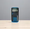 A Texas Instruments TI-30 ECO RS calculator is displayed on a wooden surface against a gray background. Voir les images du produit