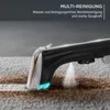 A close-up shot of a carpet cleaner in action, spraying water and cleaning a dirty carpet. Produktbild-Vorschau