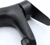 A close-up, studio shot of a black faucet on a white background. Náhľad obrázku produktu