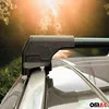 Close-up of a black roof rack on a car, with a blurred background of trees and sunlight. Náhľad obrázku produktu
