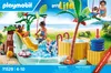A Playmobil playset depicting a water park scene with children playing on a slide and in a pool, with a hot tub and palm tree. Anteprima dell’immagine prodotto