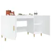 A white desk with storage compartments and wooden legs, decorated with a few items. Podgląd zdjęcia produktu