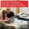 An older man and a young girl are using a laptop next to a Xerox printer. Produktbild-Vorschau