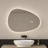 A modern bathroom vanity with a sink, faucet, and an illuminated mirror. Anteprima dell’immagine prodotto