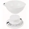 A white kitchen scale with a removable bowl. Produktbild-Vorschau
