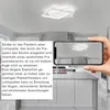 A modern kitchen with a ceiling light fixture and a smartphone displaying the same fixture. Produktbild-Vorschau