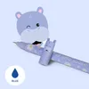A cartoon hippo illustration is shown above two purple gel pens with a daisy pattern and a blue water drop icon with the word 'BLUE' below it. Produktbild-Vorschau