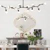 A dining room setting with a table, chairs, a fireplace, and a decorative mirror. Produktbild-Vorschau