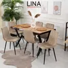A dining room set with a wooden table and beige chairs, decorated with plants and wall art. Produktbild-Vorschau