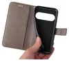 A hand is holding a gray flip phone case open, revealing the black interior where a phone would be placed. Produktbild-Vorschau