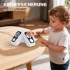 A child is touching a power strip on a table. Produktbild-Vorschau