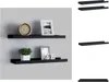 Two black shelves mounted on a gray wall, decorated with a clock, a framed picture, a plant, and another framed picture. Produktbild-Vorschau