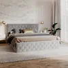 A bedroom scene with a large upholstered bed as the main focus. Produktbild-Vorschau