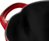 A close-up view of the inside and handle of a red Staub Cocotte. Náhľad obrázku produktu
