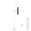 A white floor lamp with a remote control and power adapter on a white background. Náhľad obrázku produktu