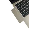 A close-up view of a laptop keyboard with a USB-C hub attached. Produktbild-Vorschau