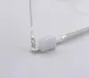A close-up view of a clear plastic shower stool hinge with a white plastic component. Produktbild-Vorschau