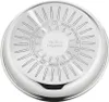 The bottom of a stainless steel pan with embossed text and radial lines. Voir les images du produit