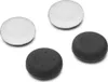 Four controller thumbstick grips, two white and two black, are arranged on a white background. Produktbild-Vorschau