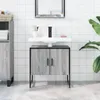 A bathroom vanity with a sink and cabinet. Produktbild-Vorschau
