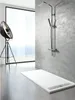 A modern bathroom setting with a shower tray and shower fixture. Produktbild-Vorschau