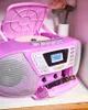 A pink boombox with a CD player and cassette deck is shown on a shelf. Produktbild-Vorschau