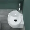 A top-down view of a white ceramic sink with a chrome faucet, set against a teal wall and gray tiled floor. Produktbild-Vorschau