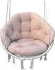 A close-up studio shot of a beige hanging swing chair cushion. Produktbild-Vorschau