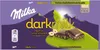 The image shows the packaging of Milka darkmilk hazelnut chocolate with a mountain landscape. Anteprima dell’immagine prodotto
