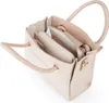 A top-down view of an open beige handbag. Podgląd zdjęcia produktu