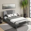 A bedroom scene with a bed, artwork, and a plant. Náhľad obrázku produktu
