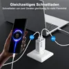 A hand holding a smartphone that is charging, connected to a laptop via a white USB-C charger plugged into a wall socket. Produktbild-Vorschau