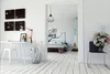 A bright and airy room with a desk area and a bedroom visible through a doorway. Produktbild-Vorschau