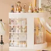 A makeup organizer filled with various cosmetic products and brushes. Náhled obrázku produktu