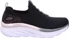 A side view of a black Skechers sneaker with a white sole. Náhled obrázku produktu