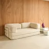 A beige corduroy sofa with a chrome frame is placed against a wooden wall. Anteprima dell’immagine prodotto