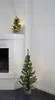 Two small, decorated Christmas trees are shown in a room, one on a fireplace mantel and another on the floor. Produktbild-Vorschau