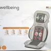 The image shows the packaging of a Beurer massage cushion, with the product itself partially visible. Voir les images du produit